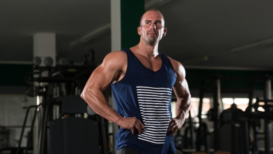 a man in his 30s–40s doing body building exercise